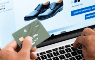 Man buying shoes online using credit card