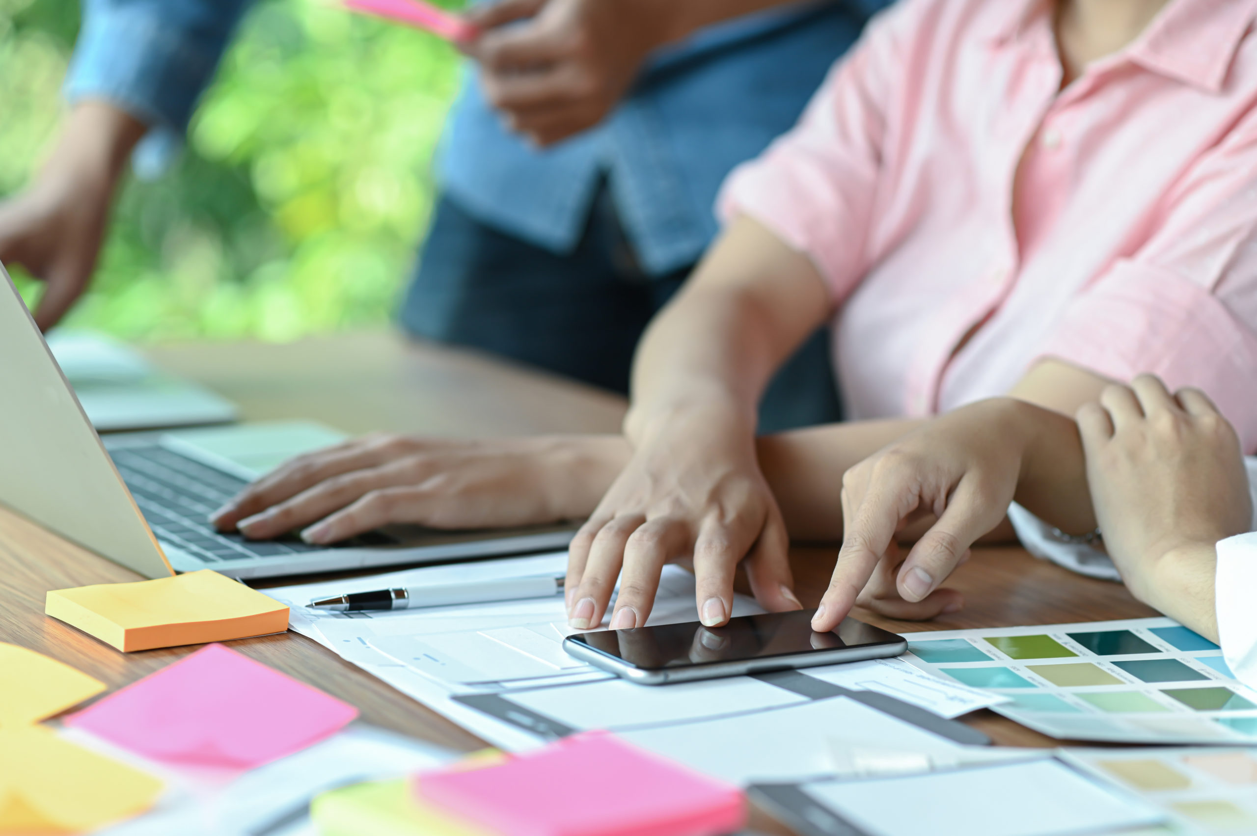 A team of professional application designers are designing mobil