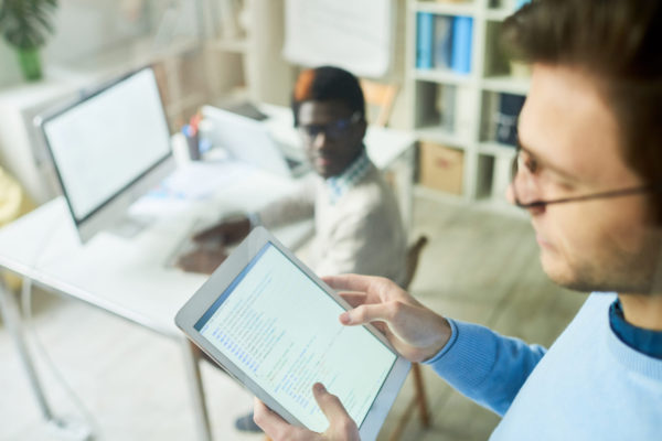 Web Developer Holding Tablet Web Developer Holding Tablet