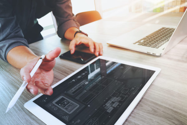 Website designer working digital tablet and computer laptop and Website designer working digital tablet and computer laptop and