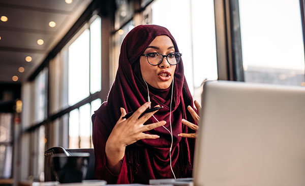 woman wearing a hijab on a video call