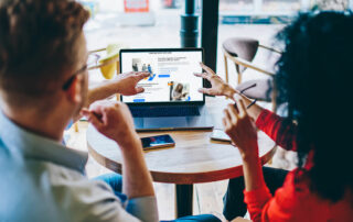 Man and woman discussing website