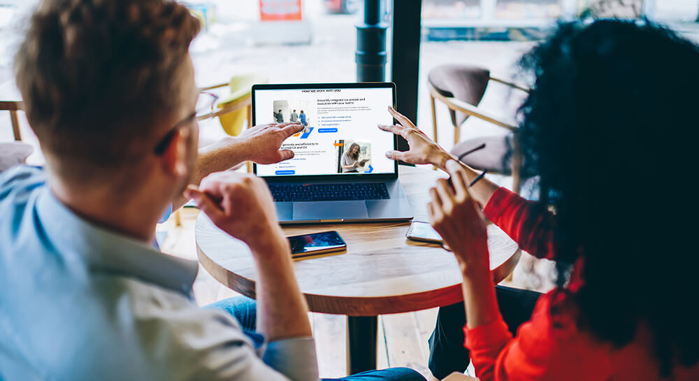 Man and woman discussing website