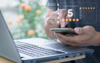 Person giving 5 star review via their phone