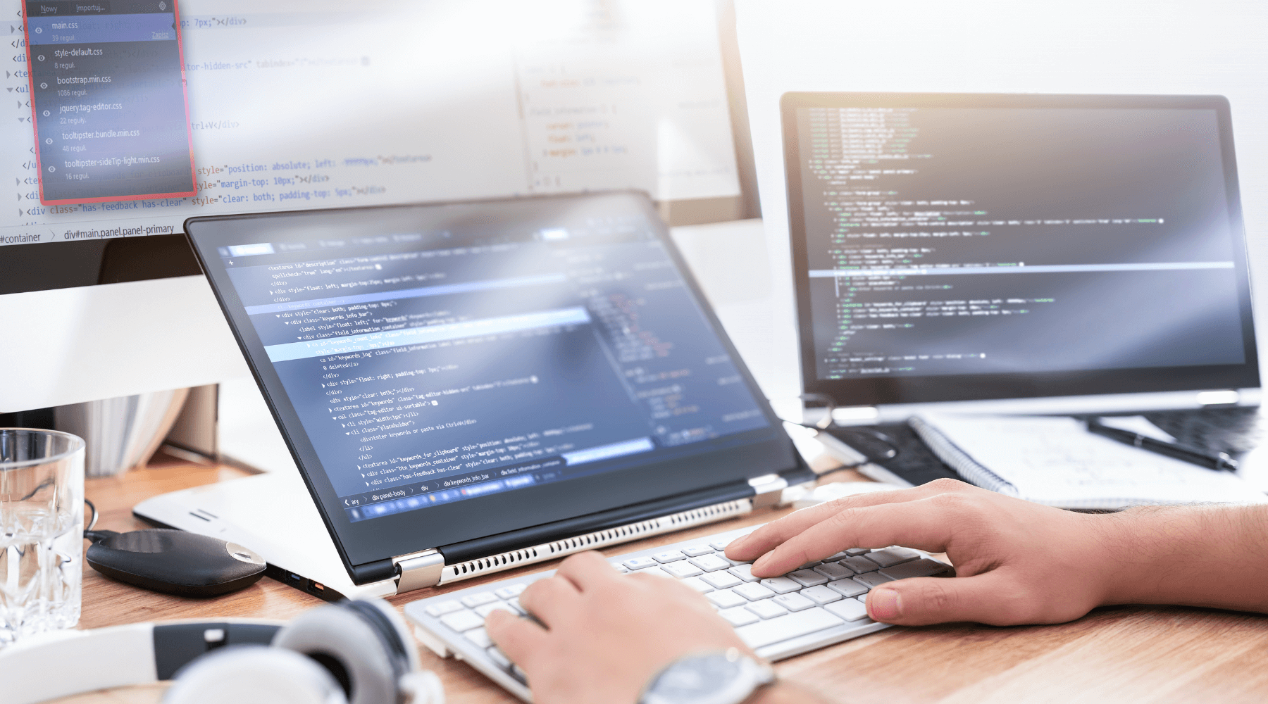 mans hands at desk computer developing